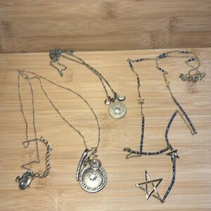 Bundle of 3 celestial gold tone necklaces.